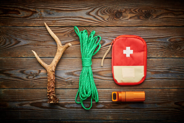 travel-items-for-hiking-over-wooden-background